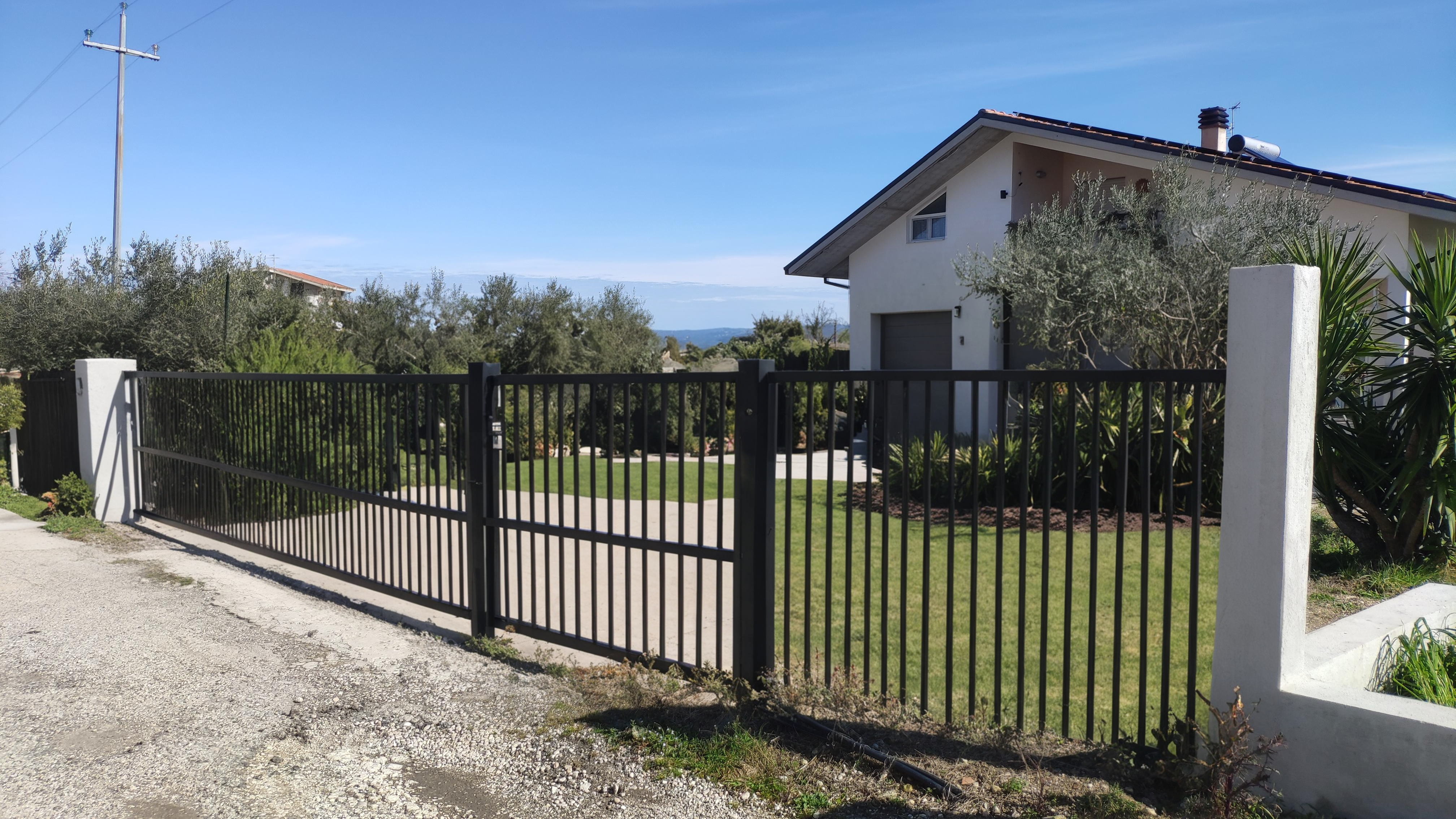 Transform your digital creations with Inpaint, the AI tool that seamlessly replaces selected elements with stunning new content. This image showcases a beautifully maintained property with a sleek, modern fence, highlighting Inpaint's ability to enhance and refine visual details effortlessly.