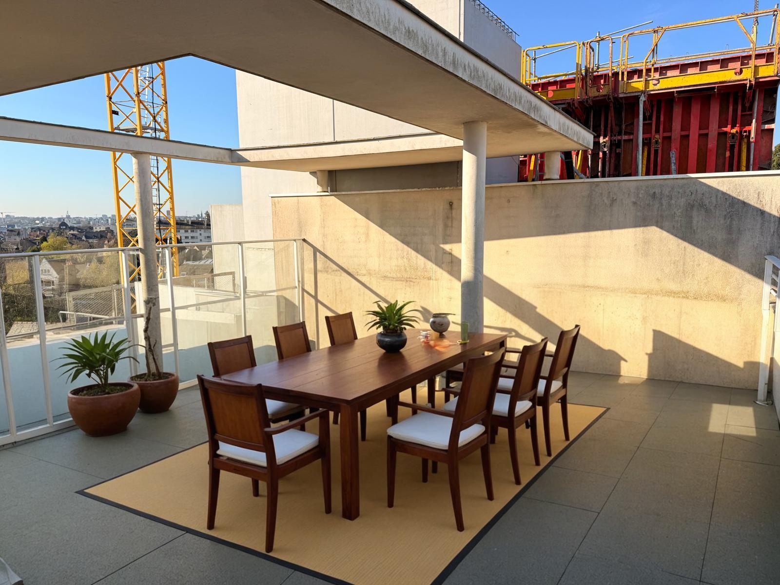 Transform your outdoor space with the power of Inpaint! This stunning image showcases a beautifully designed terrace featuring a sleek dining table and chairs, enhanced by lush green plants. With Inpaint, you can effortlessly replace elements in your images, creating seamless and visually appealing designs like this one. Perfect for showcasing the capabilities of AI-driven editing tools in transforming your living spaces.